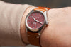 Shot of the Oak & Oscar Olmsted FEW limited edition on wrist on male with tan color sweater